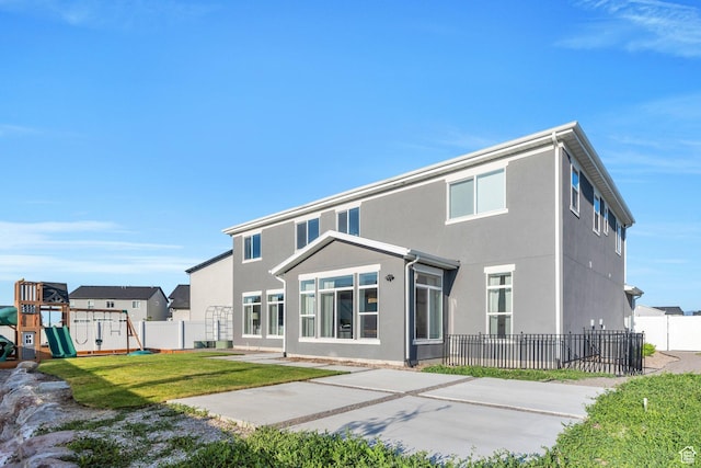 1031 S 950 W, American Fork, UT 84003 - back of property featuring a playground, a patio, and stucco siding