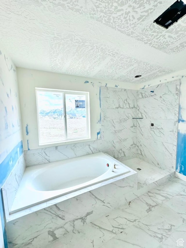1708 S 4300th St W Unit 102, West Weber, UT 84401 - bathroom with a marble finish shower, a bath, marble finish floor, and a textured ceiling