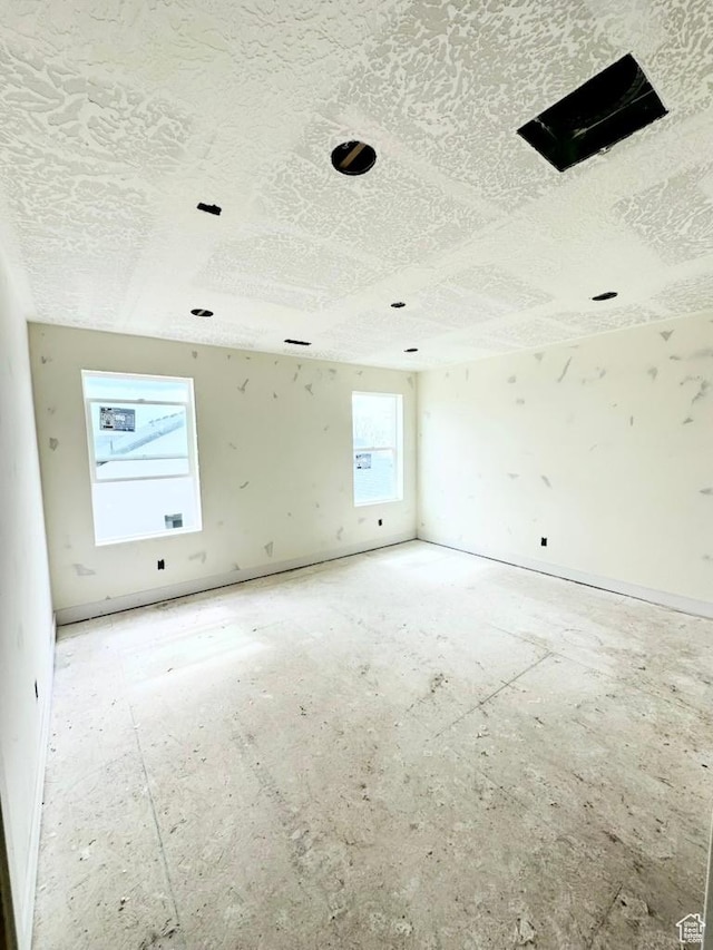 1708 S 4300th St W Unit 102, West Weber, UT 84401 - spare room with a textured ceiling