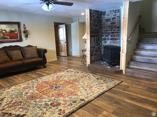 11741 E 14330 N Unit 232, Mount Pleasant, UT 84647 - living area with wood finished floors, a wood stove, stairway, and a ceiling fan