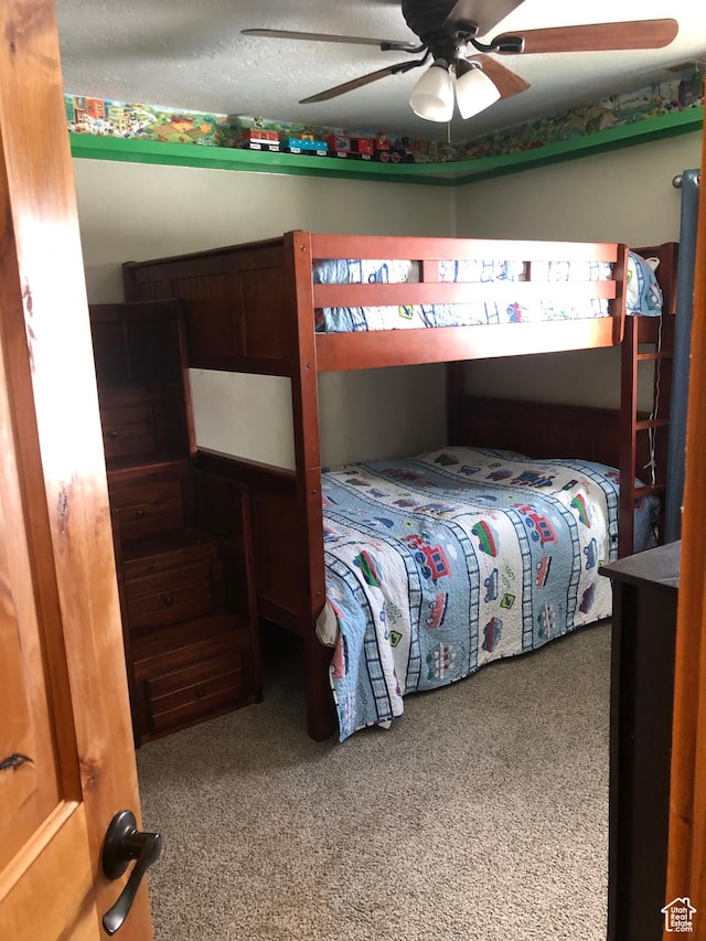11741 E 14330 N Unit 232, Mount Pleasant, UT 84647 - carpeted bedroom featuring a ceiling fan and a textured ceiling