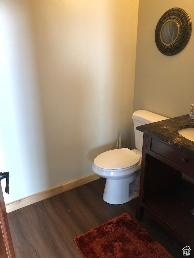 11741 E 14330 N Unit 232, Mount Pleasant, UT 84647 - half bathroom with baseboards, toilet, wood finished floors, and vanity