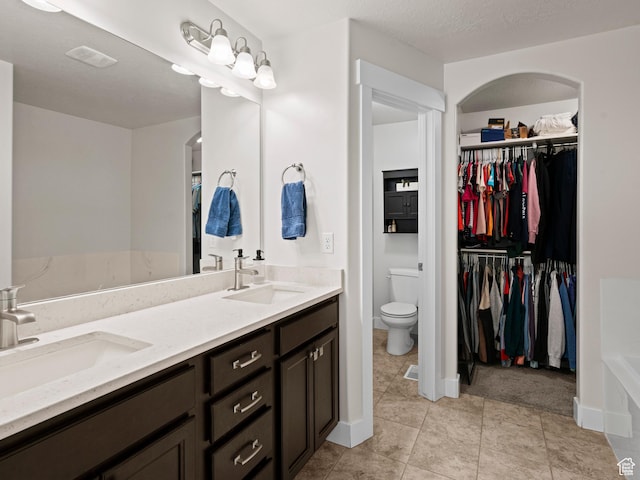 4981 W Longboat Ln, Herriman, UT 84096 - full bath with toilet, a sink, a walk in closet, and visible vents