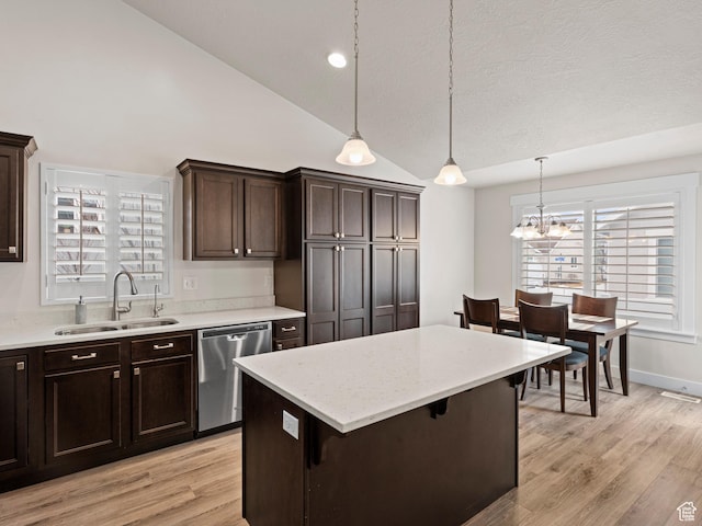 4981 W Longboat Ln, Herriman, UT 84096 - kitchen with lofted ceiling, a sink, light wood finished floors, dishwasher, and dark brown cabinets