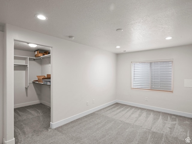 4981 W Longboat Ln, Herriman, UT 84096 - unfurnished bedroom featuring baseboards, carpet flooring, a textured ceiling, and recessed lighting