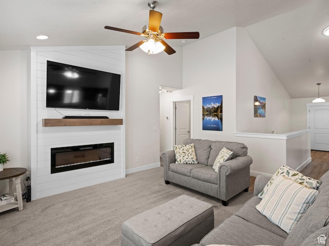 4981 W Longboat Ln, Herriman, UT 84096 - carpeted living area with a large fireplace, baseboards, vaulted ceiling, and ceiling fan