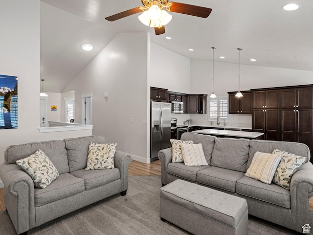 4981 W Longboat Ln, Herriman, UT 84096 - living area featuring light wood-type flooring, high vaulted ceiling, ceiling fan, and recessed lighting