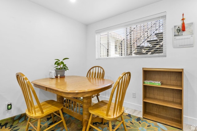 314 W Center St Unit F118, Bountiful, UT 84010 - dining room featuring baseboards and wood finished floors