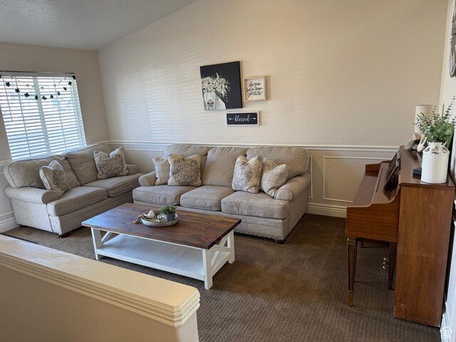 4625 W Harvey Blvd, Cedar Hills, UT 84062 - carpeted living room featuring wainscoting and a decorative wall