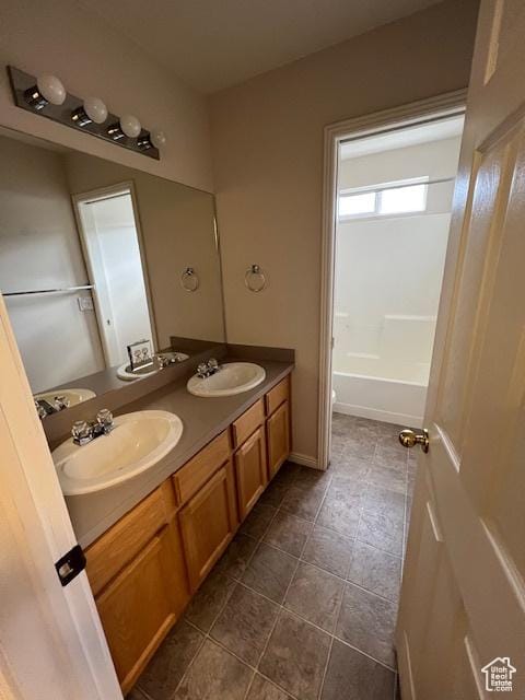 4625 W Harvey Blvd, Cedar Hills, UT 84062 - full bathroom featuring double vanity, a sink, and tile patterned flooring