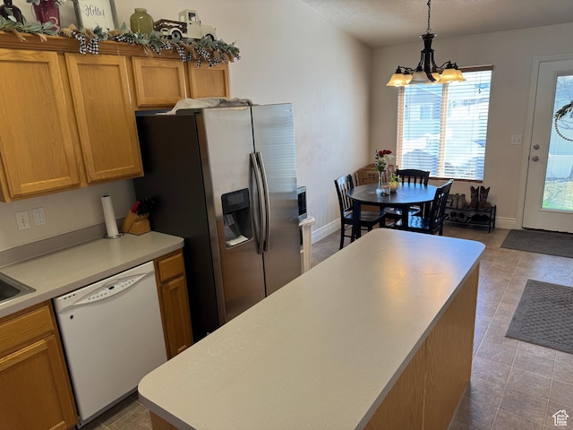 4625 W Harvey Blvd, Cedar Hills, UT 84062 - kitchen with light countertops, stainless steel fridge, hanging light fixtures, white dishwasher, and a notable chandelier