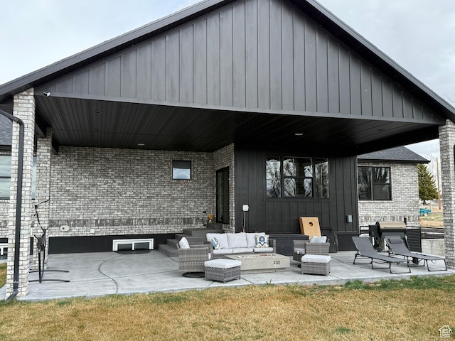340 E 300 N, Moroni, UT 84646 - back of property featuring an outdoor hangout area, a patio area, and board and batten siding