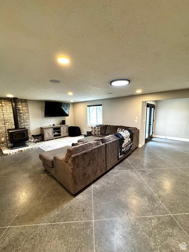 340 E 300 N, Moroni, UT 84646 - living area featuring a wood stove, a textured ceiling, recessed lighting, and baseboards