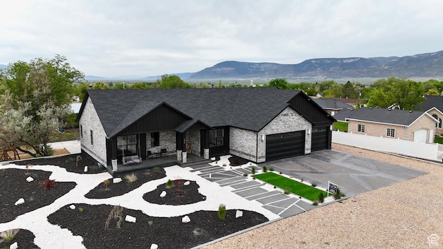 340 E 300 N, Moroni, UT 84646 - view of front facade featuring a garage, a porch, board and batten siding, and a mountain view