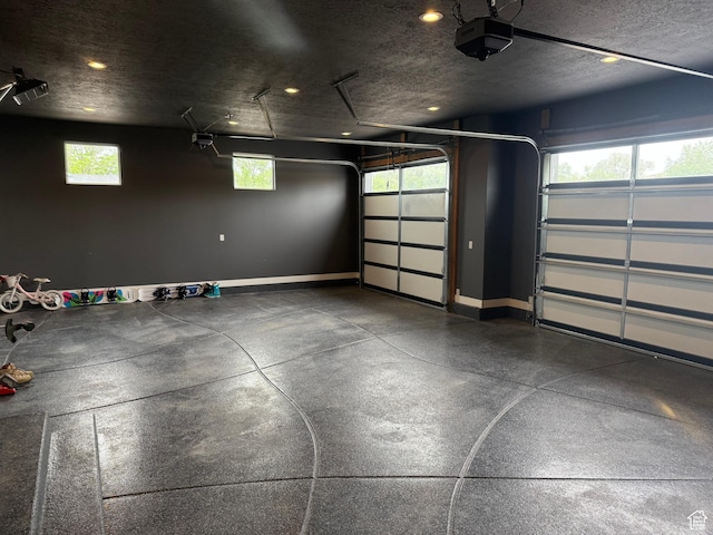 340 E 300 N, Moroni, UT 84646 - garage featuring a garage door opener, baseboards, and recessed lighting
