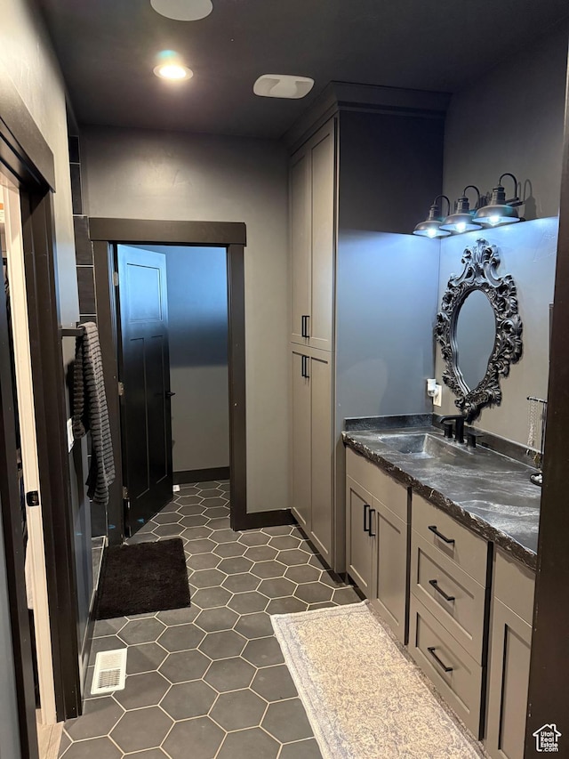 340 E 300 N, Moroni, UT 84646 - bathroom featuring double vanity, tile patterned flooring, and recessed lighting