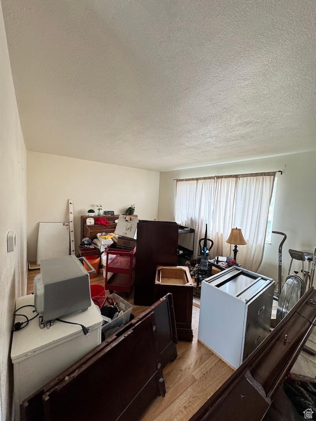 627 E Valley View Dr, Tooele, UT 84074 - office area with a textured ceiling and wood finished floors