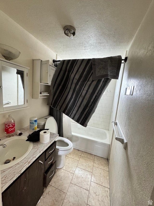 627 E Valley View Dr, Tooele, UT 84074 - full bath with tile patterned flooring, vanity, toilet, a textured ceiling, and shower / bathtub combination