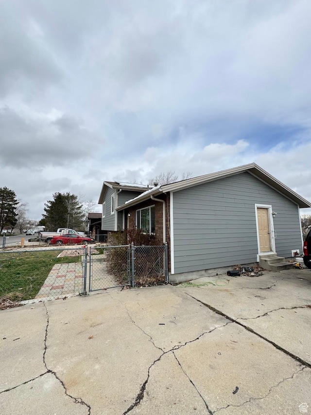 627 E Valley View Dr, Tooele, UT 84074 - view of side of property featuring a gate and fence
