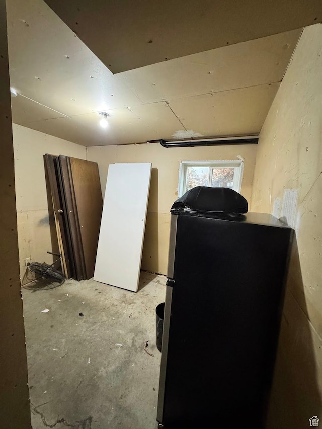 627 E Valley View Dr, Tooele, UT 84074 - below grade area featuring freestanding refrigerator