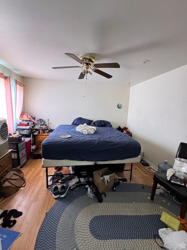627 E Valley View Dr, Tooele, UT 84074 - bedroom with light wood finished floors and ceiling fan