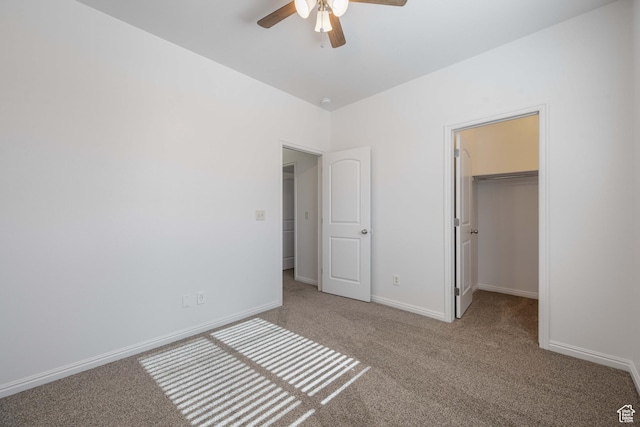 954 N Ocotillo Dr, Washington, UT 84780 - unfurnished bedroom with a closet, a spacious closet, baseboards, ceiling fan, and carpet