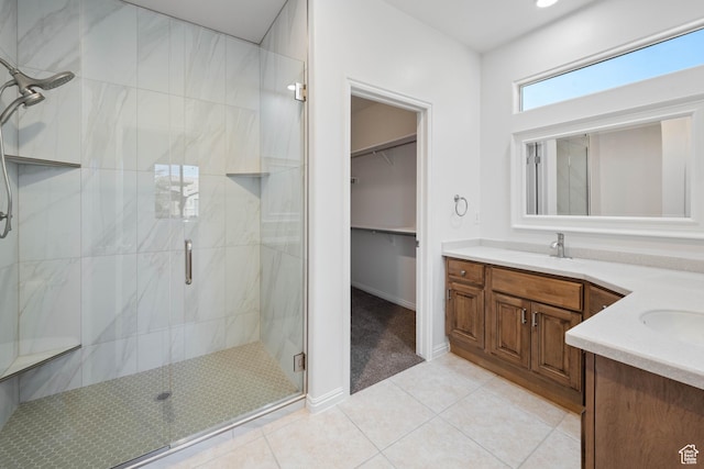 954 N Ocotillo Dr, Washington, UT 84780 - full bath featuring a stall shower, a sink, a spacious closet, tile patterned flooring, and double vanity