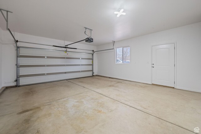954 N Ocotillo Dr, Washington, UT 84780 - garage featuring a garage door opener and baseboards