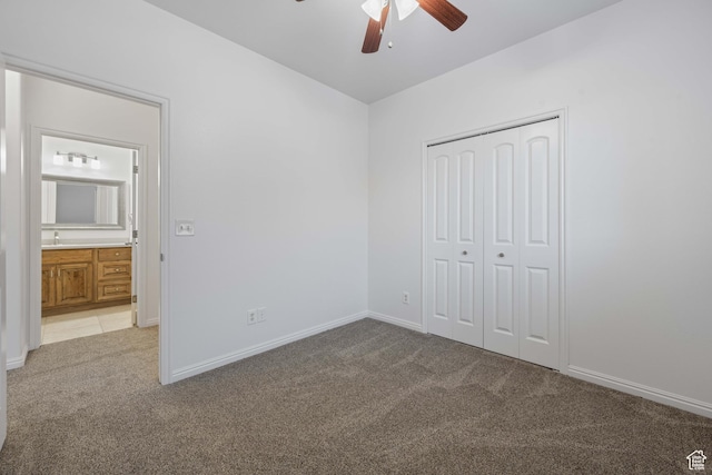 954 N Ocotillo Dr, Washington, UT 84780 - unfurnished bedroom featuring light carpet, baseboards, a closet, and ceiling fan
