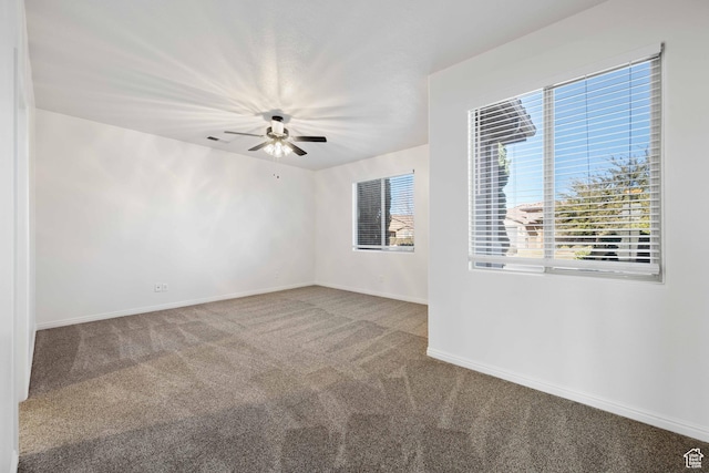 954 N Ocotillo Dr, Washington, UT 84780 - carpeted spare room with baseboards, visible vents, and a ceiling fan