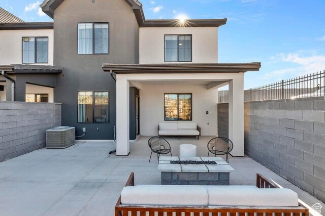 1627 S Ripple Rock Dr Unit 3002, Washington, UT 84780 - back of house with central AC unit, a fenced backyard, an outdoor living space, stucco siding, and a patio area