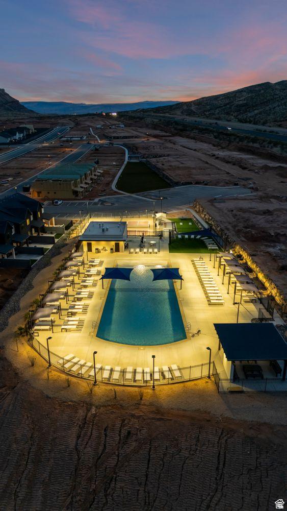 1627 S Ripple Rock Dr Unit 3002, Washington, UT 84780 - pool at dusk featuring fence