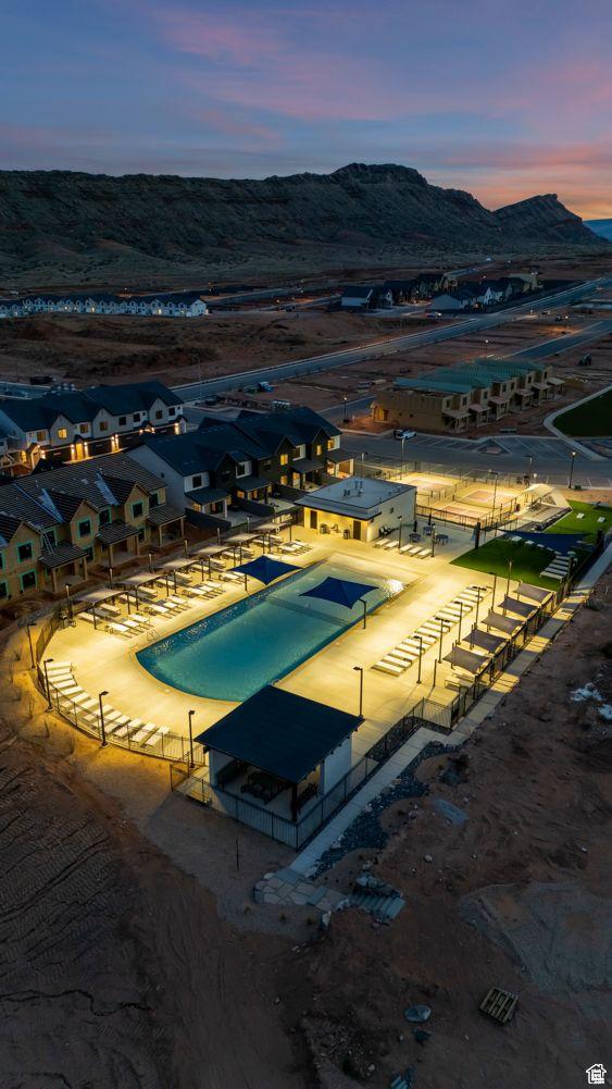 1627 S Ripple Rock Dr Unit 3002, Washington, UT 84780 - pool at dusk featuring a residential view and a mountain view