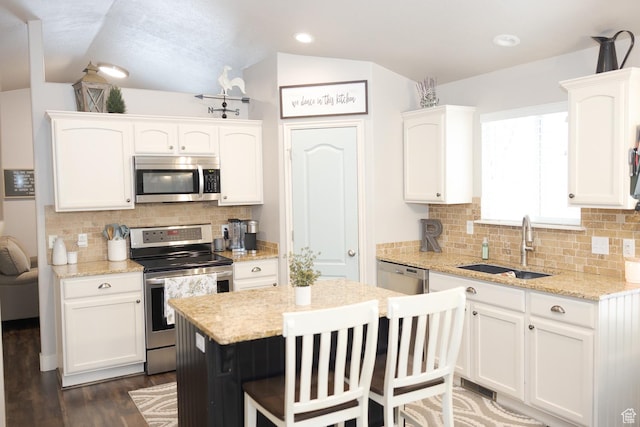 1751 E 1130 S, Spanish Fork, UT 84660 - kitchen with appliances with stainless steel finishes, white cabinetry, a sink, decorative backsplash, and vaulted ceiling