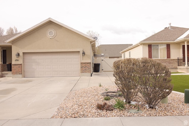 1751 E 1130 S, Spanish Fork, UT 84660 - view of front of house with brick siding, driveway, and a gate