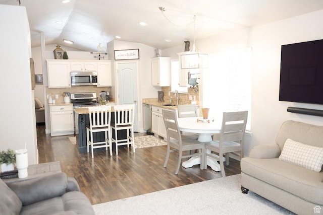1751 E 1130 S, Spanish Fork, UT 84660 - living room with dark wood finished floors, lofted ceiling, and recessed lighting