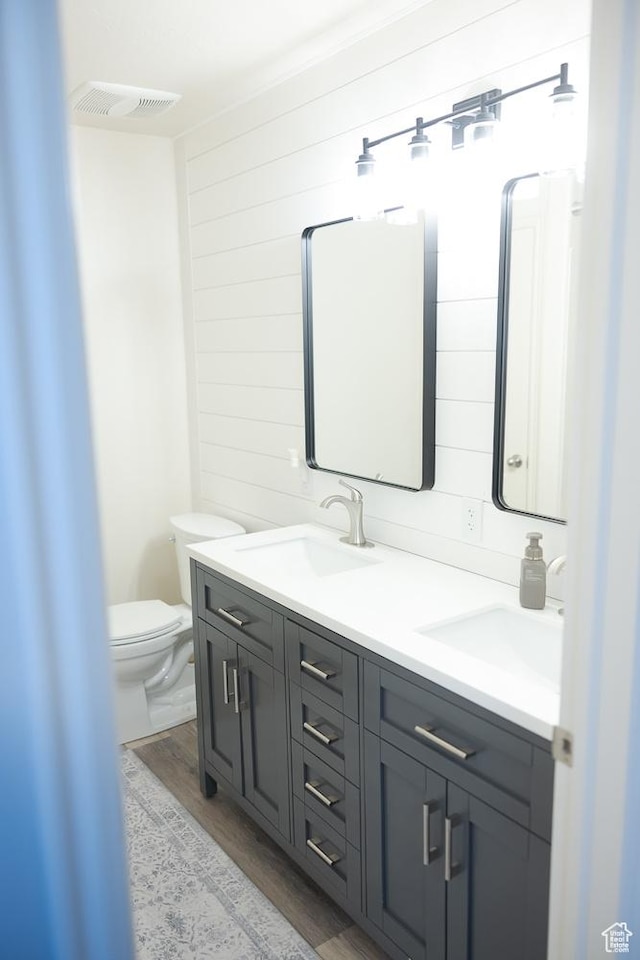 1751 E 1130 S, Spanish Fork, UT 84660 - bathroom featuring double vanity, wood finished floors, toilet, and wood walls