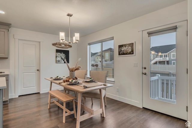 138 N Valcrest Dr, Saratoga Springs, UT 84045 - dining space featuring an inviting chandelier, dark wood-style floors, and baseboards