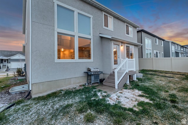 138 N Valcrest Dr, Saratoga Springs, UT 84045 - rear view of house featuring stucco siding and fence