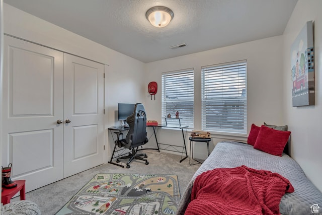 138 N Valcrest Dr, Saratoga Springs, UT 84045 - carpeted bedroom featuring a closet, a textured ceiling, and visible vents