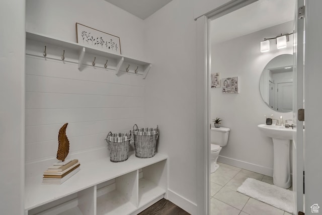 138 N Valcrest Dr, Saratoga Springs, UT 84045 - interior space with a sink, baseboards, toilet, and tile patterned flooring