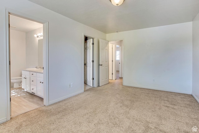 1494 E 1300 S, Provo, UT 84606 - unfurnished bedroom with light colored carpet, connected bathroom, and a spacious closet