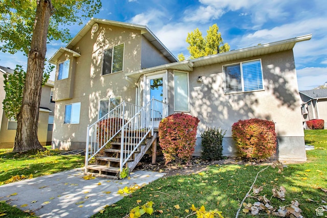1494 E 1300 S, Provo, UT 84606 - view of front of home featuring stucco siding and a front yard