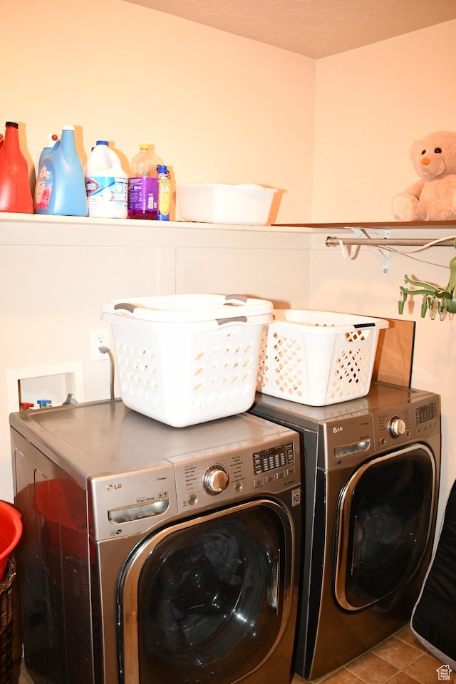 148 N Walton Ct W, North Salt Lake, UT 84054 - clothes washing area with tile patterned flooring, washing machine and dryer, and laundry area