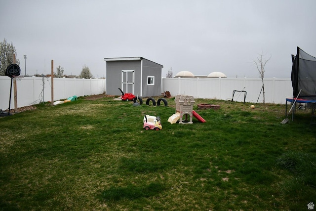 148 N Walton Ct W, North Salt Lake, UT 84054 - view of yard with a fenced backyard, a storage shed, an outbuilding, and a trampoline