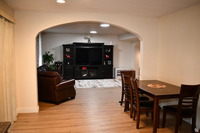 148 N Walton Ct W, North Salt Lake, UT 84054 - dining space with light wood-type flooring, arched walkways, and recessed lighting