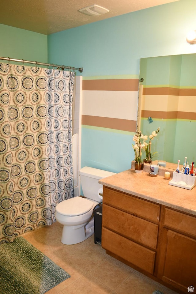 148 N Walton Ct W, North Salt Lake, UT 84054 - full bathroom featuring a textured ceiling, a shower with shower curtain, toilet, tile patterned floors, and vanity