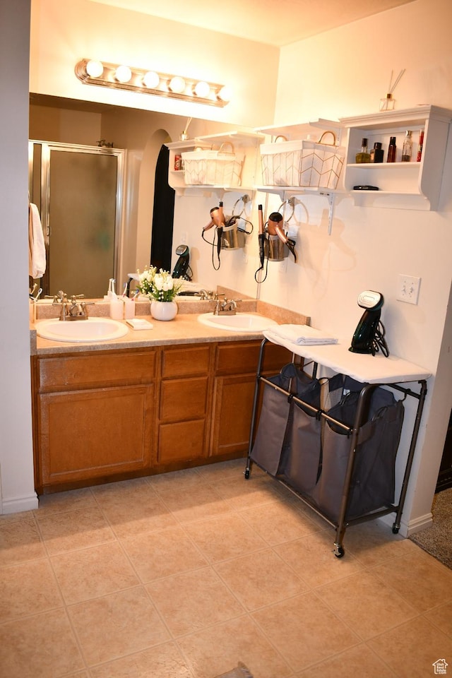 148 N Walton Ct W, North Salt Lake, UT 84054 - bathroom featuring a shower stall, double vanity, a sink, and tile patterned floors