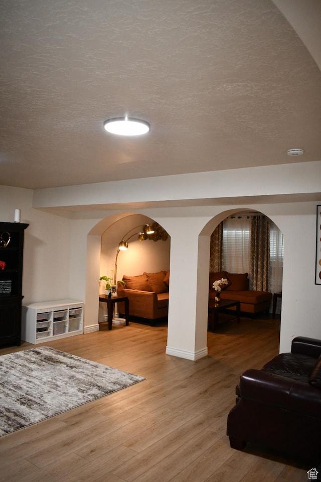 148 N Walton Ct W, North Salt Lake, UT 84054 - interior space with baseboards, wood finished floors, arched walkways, and a textured ceiling