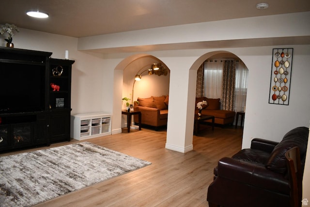 148 N Walton Ct W, North Salt Lake, UT 84054 - living area with baseboards, light wood-type flooring, and arched walkways